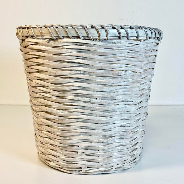 A lovely white washed woven split reed wicker wastebasket works for many rooms of your home. The finish is perfect to...