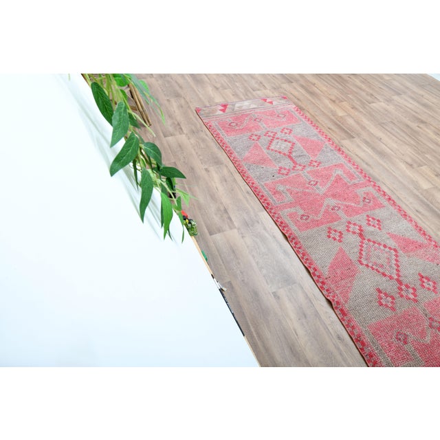 Vintage Turkish Hand-Knotted vintage rug is a semi- vintage area rug.'70s Eastern region of Turkey's unique rug is...