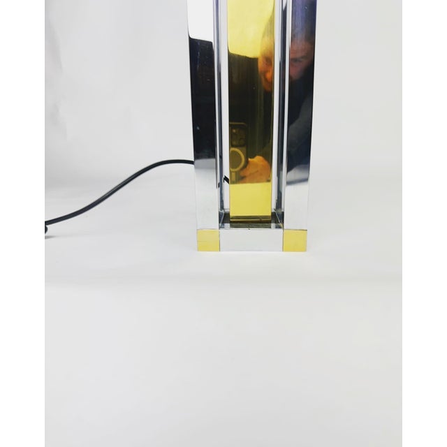 Beautiful mid century table lamp. Lamp from the 1970s made by the German WKR Leuchten. Sleek design in a combination of...