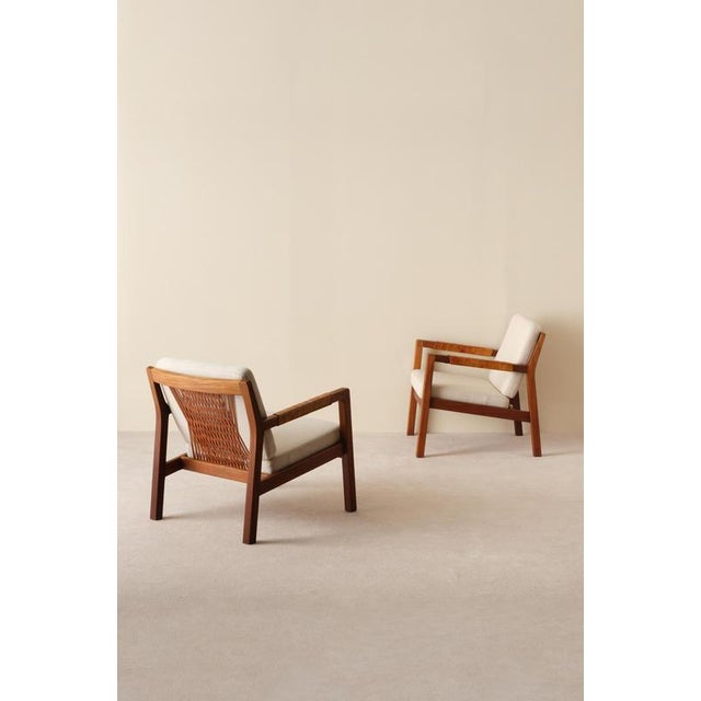 Armchairs model "Rialto" by Carl-Gustav Hiort af Ornäs, Finland, 1950s. Leather covered armrests, back with braided...