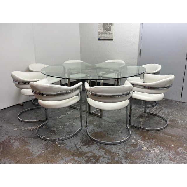 Design Plus Gallery presents a Contemporary Glass Dining Table + Set of Eight White Leatherette Dining Chairs by VIG...