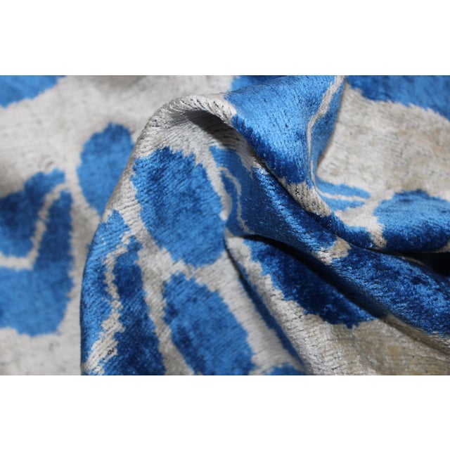 Bohemian silk velvet ikat pillow with vibrant colors of beige and blue. Super hand soft. Pillow has a zipper for closure...