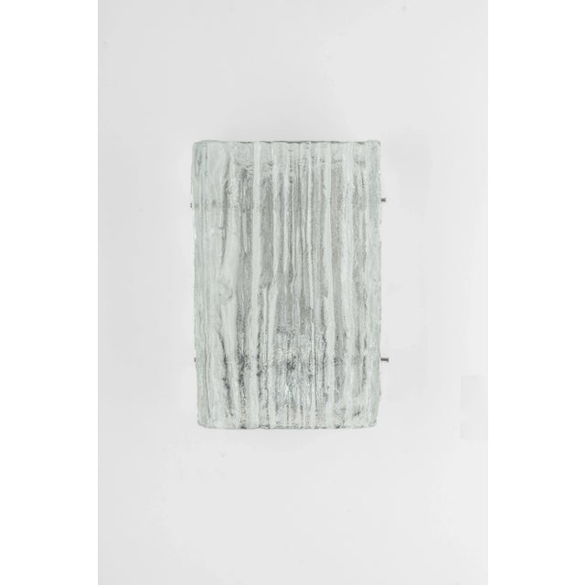 Wonderful pair of midcentury wall sconces with ice glass, made by kalmar, austria, manufactured, circa 1960-1969. High...