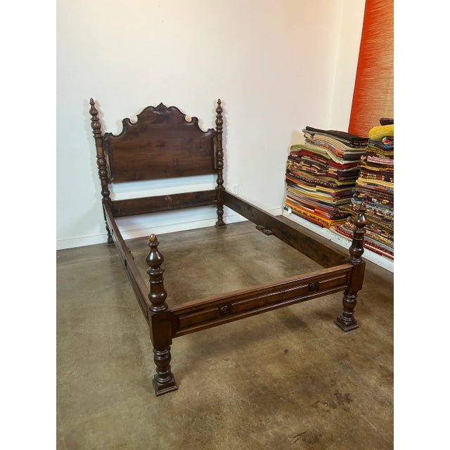 Twin walnut bed with handcarved columns at headboard and footboard. Circa 1880-1890. Florence, Italy.