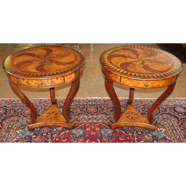 Pair of Theodore Alexander Burl Inlaid Metal Mount Occasional End Tables Dimensions : 27" Round X 28.5" Tall This pair of...
