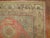 One-of-a-kind early 20th century Khotan rug with a soft pink field consisting of a yin yang pattern and a camel border....
