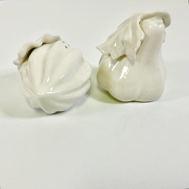 Fitz & Floyd produce mostly colorful ceramics, but this set of Salt & Pepper Shakers are beautiful in a Blanca white....