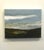 Earth Sky Sea captures the serene meeting of land and sky through a rich interplay of colors and textures. The encaustic...