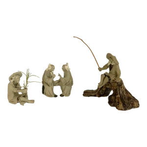 Trio of Mud Men Sculptures