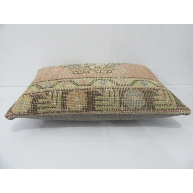 Decorative pillow cover made from a vintage Turkish handknotted rug. Backed with good quality cotton fabric. Pillow...