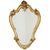 Large vintage mirror with a decorative crest, crafted in a classic Baroque style from resin and finished with gold leaf;...