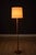 Mid Century Modern floor lamp in solid teak, made in Sweden circa 1960s. This piece features a tapered stem supported by a...