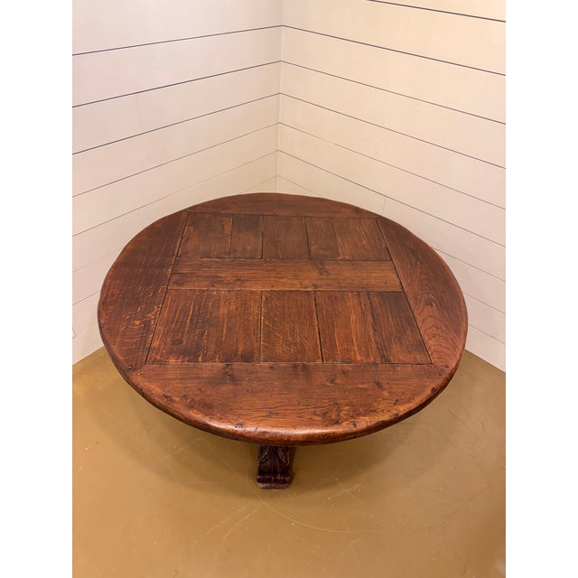 This beautiful and sturdy 54" round French table has a lovely carved trestle leg base and pedestal support. Circa 19th...