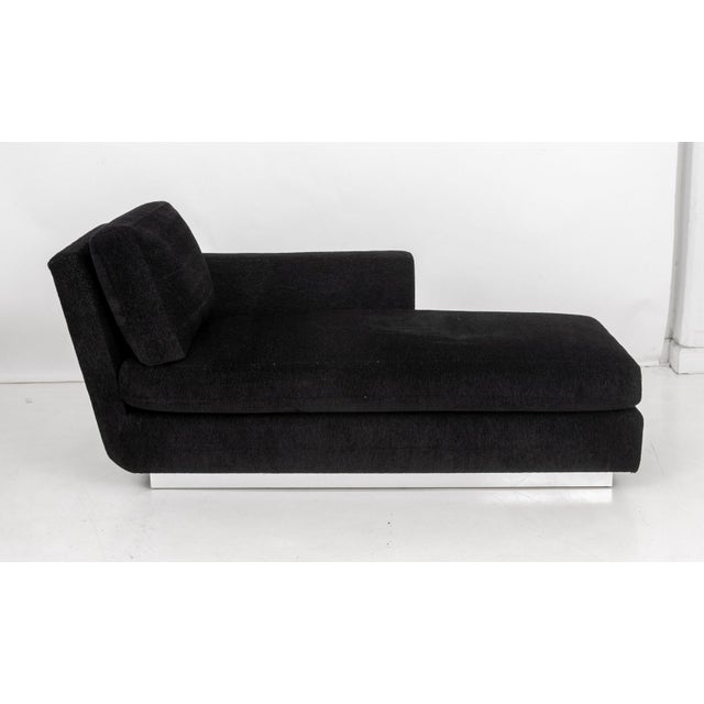 Modern Black Upholstered Chaise Longue, on a rectangular mirrored base. 34" H x 72" W x 34" D; seat: 18" H. Provenance:...