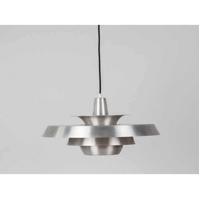 This beautiful aluminum pendant lamp was designed in the 1980s by Danish designer David Mogensen for the Danish lighting...