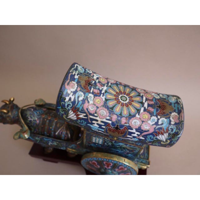 Early 20th century Republic Period China cloisonné ox pulling a cart. Bright turquoise enamel accented with red, pink,...