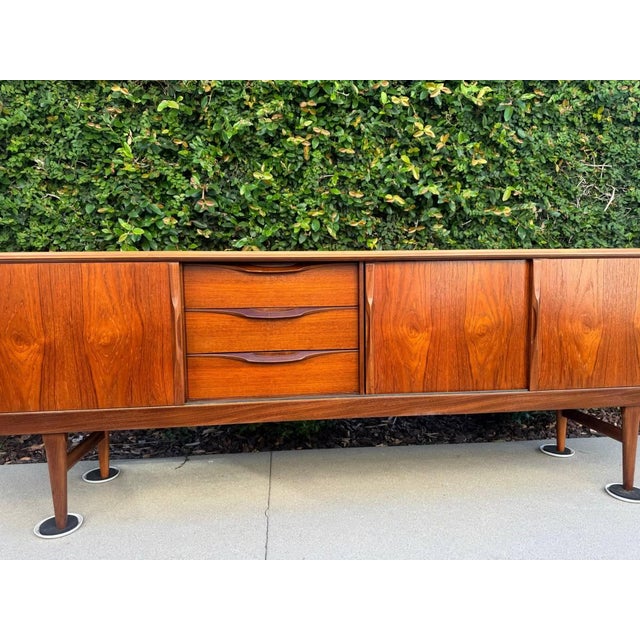 ABX52 Mid-Century Modern Teak Sideboard Credenza Beautiful vintage mid-century modern teak sideboard, crafted in the...