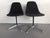 Pair of Herman Miller Eames swivel base office chairs. The chairs are in black fabric and are dated 1983. Labels and marks...