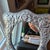 This handcrafted Mexican pewter tabletop mirror by Treasure Seekers showcases intricate folk art design with a rose motif....