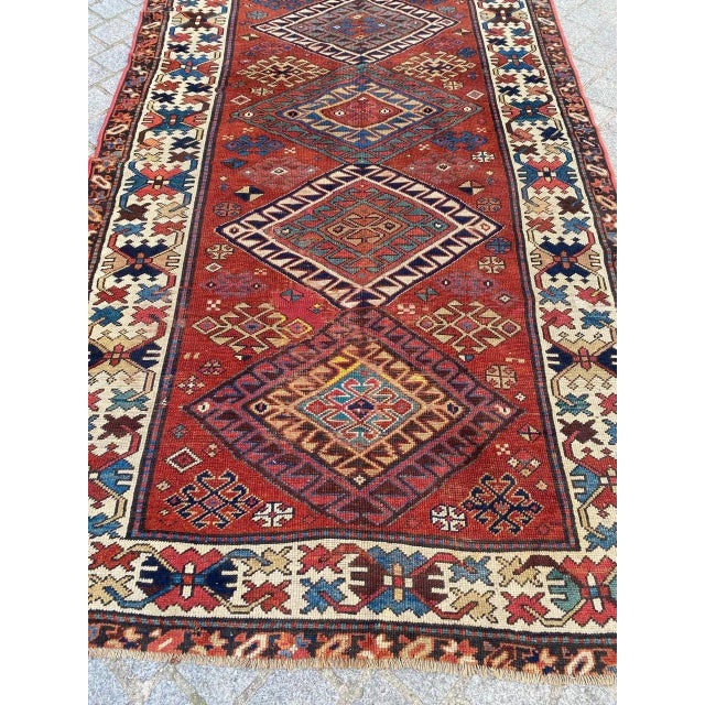 Nice late 19th century Caucasian Kazak runner with beautiful geometrical design and nice natural colors, entirely hand...