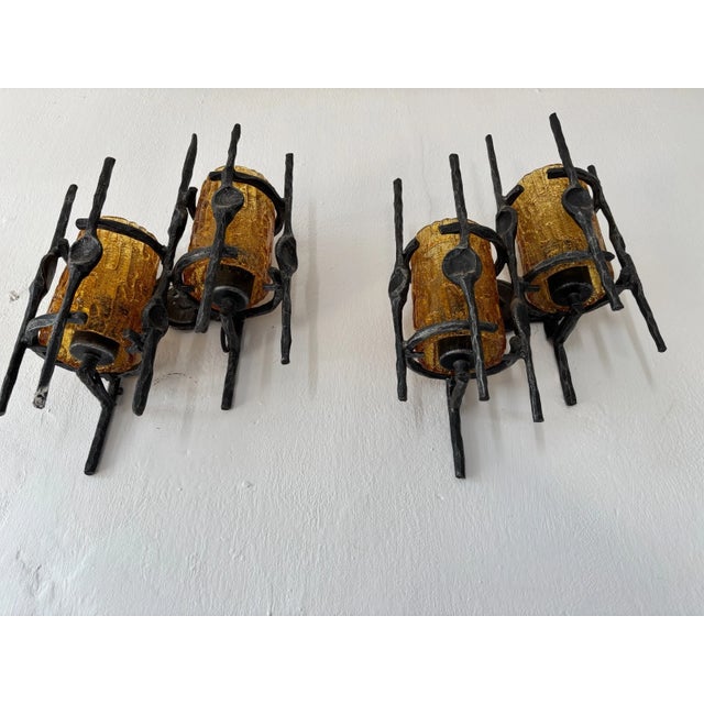 Pair of brutalist sconces with thick amber Murano glass covering bulbs. Will be rewired with certified UL US socket for...