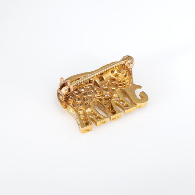 Finley detailed Cartier diamond elephant brooch crafted in 18k yellow gold (circa 1980s to 1990s) Pave set diamonds total...