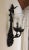 Iron wall sconce with two lights. Tuscan influenced with seeded glass. Allows up to 60 watt bulbs. No imperfections noted.