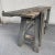 Antique violin makers workbench painted in grey.