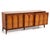 An "Arched" series nine drawer dresser by Thomasville. The dresser features a solid wood frame, walnut and burlwood veneer...