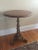 A very rare pair of vintage dolphin pedestal tables. The tables have a gilded cast iron base and column that supports a...