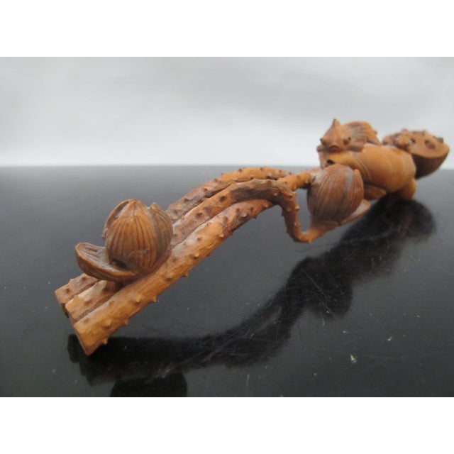 Chinese, finely hand carved boxwood ruyi scepter in stylized lotus form featuring small fish nestled on lotus leaves and...