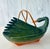 This graceful hand-woven rattan wicker basket in the shape of a swan is truly a vintage (circa 1970's) work of art and in...