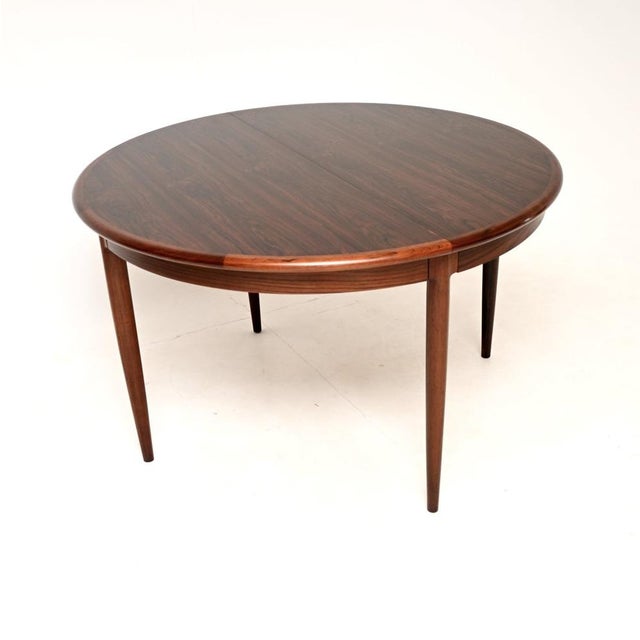 An incredibly stylish and extremely well made vintage Danish extending dining table by Niels Moller. This was made in...