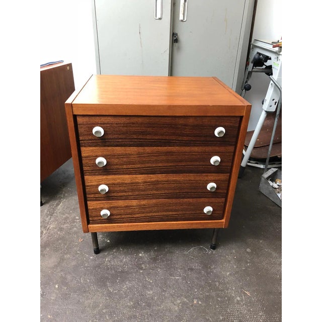 This vintage dresser comes with its original mirror and was manufactured in the 1960s. It remains in good condition....
