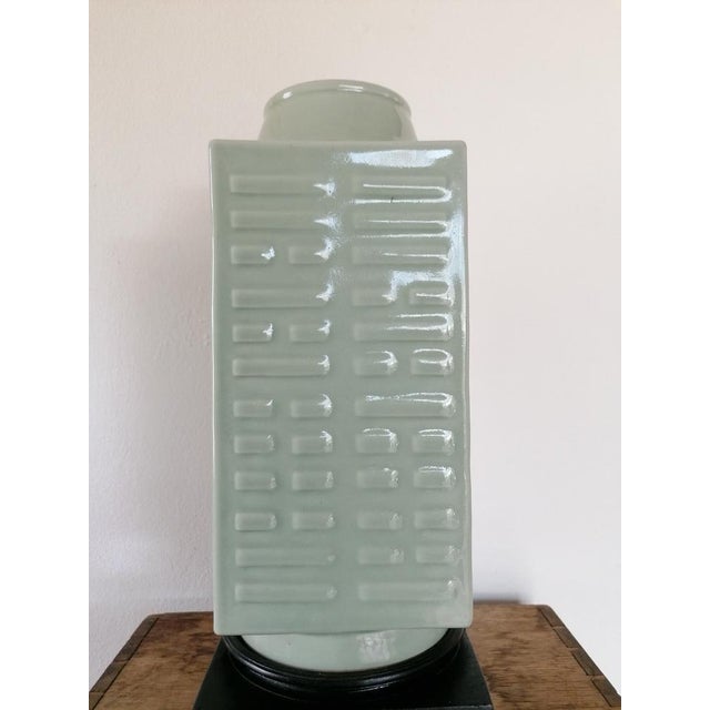 A Celadon glazed "Cong" vase from the period 1908 - 1911. These vases are famous of their repetitive (modern) outer. The...