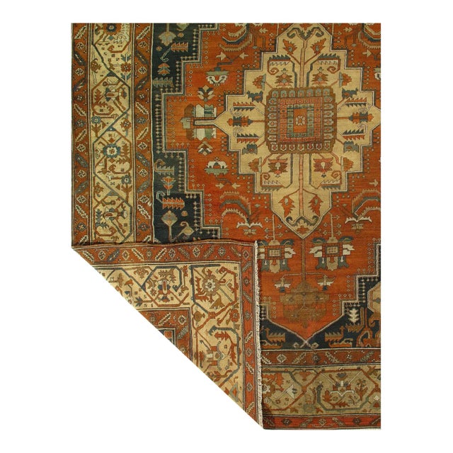 This stunning Persian Serapi rug is an immediate eye catcher featuring gorgeous colors. The middle consists of eight...