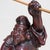 An impressive Japanese statue of Ebisu, the god of fishing, commerce and prosperity, executed in dark reddish-brown...