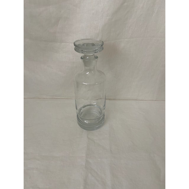 Glass decanter with flat top stopper. Some general marks and wear but no cracks or chips.