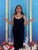 Bring Forth Miracles by Aixa Oliveras | Oil and 24kt gold leaf on panel Woman in black dress surrounded by flowers. For Sale