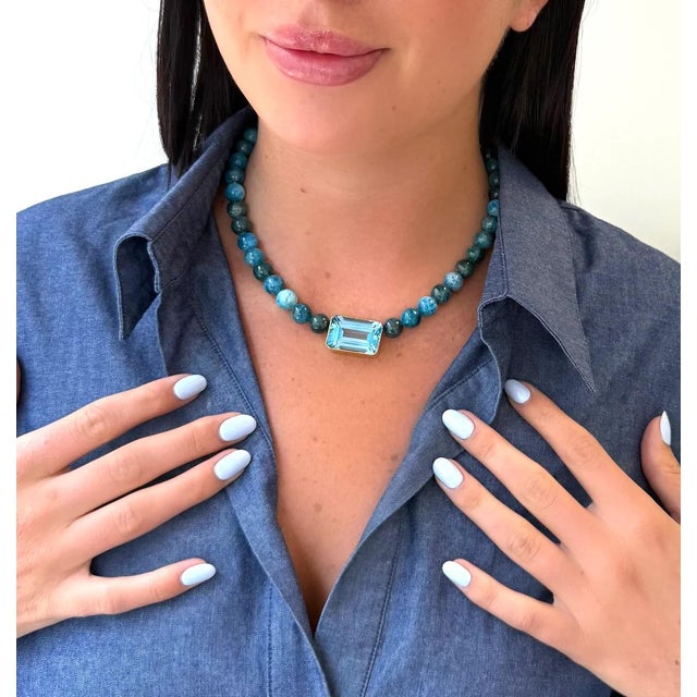 This necklace features the rich hues of all natural Apatite and an emerald cut Brazilian Blue Topaz. Limited Edition...