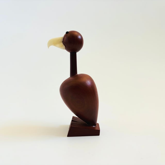 A mid century turned wood figurine in the shape of a condor. Adorable stylized features. Made in Japan by Senshukai as...