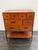 Design Plus Gallery presents a Vintage Asian Influenced Orange Lacquered Drawer Chest. This vintage chest has an orange...