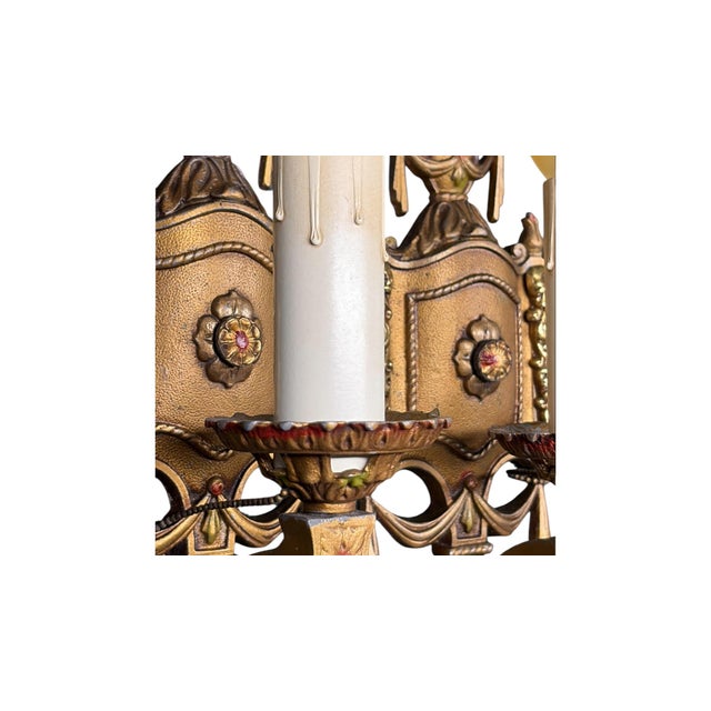Lovely sconces typical of the 1920s in cast aluminum. These have their original finish in gold with red and green...