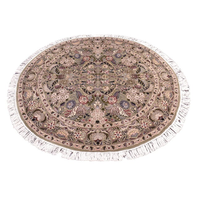 This hand‑knotted Pak Persian round rug showcases the finest expression of traditional Persian artistry. Each piece is...
