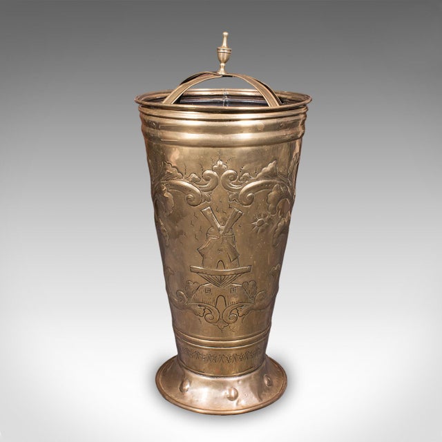 This is an antique hotel foyer umbrella stand. A Dutch, brass walking stick rack, dating to the late Victorian period,...