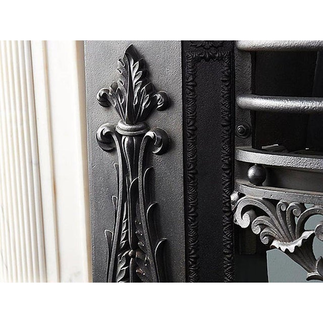 A decorative and very well cast hob grate from the early 19th century from renowned foundry Coalbrookdale. Stamped Dale.co...