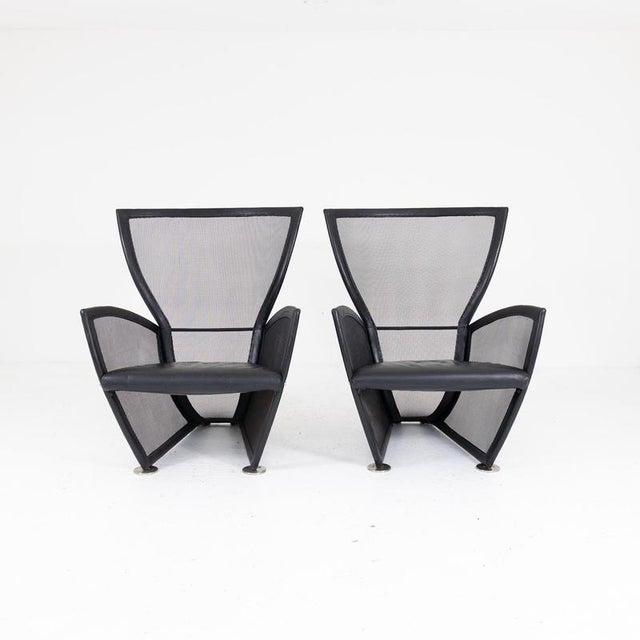 Pair of Privé model armchairs, designed by Paolo Nava for Arflex in the 1980s. The Privé series armchairs, made of metal...