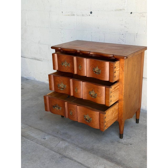 Beautiful vintage Danish modern teak bachelor chest or nightstand made in Denmark, featuring sculptural serpentine drawer...