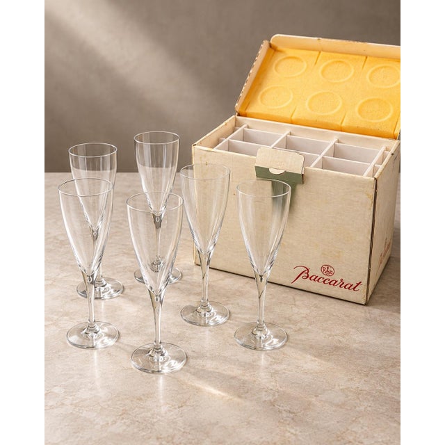 Baccarat Crystal Champagne Glasses – Set of 12 An elegant collection of 12 Baccarat-marked crystal champagne glasses,...