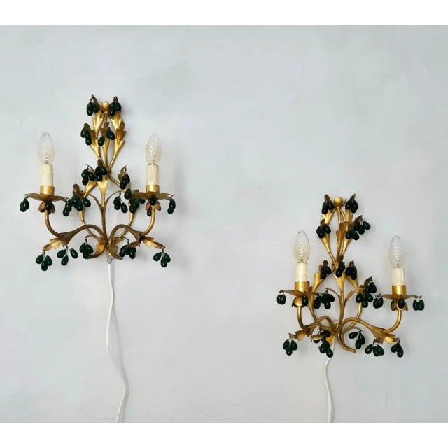 A beautiful pair of Hollywood Regency style wall sconces in gilt metal and dark green drop shaped glass decor. E14 lamp...